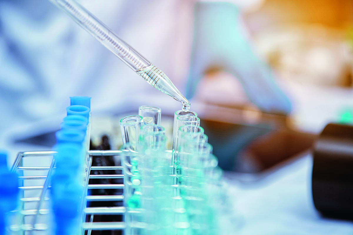 Medical,Or,Scientific,Researcher,Researching,And,Experimenting,Multi-colored,Solution,,Vial